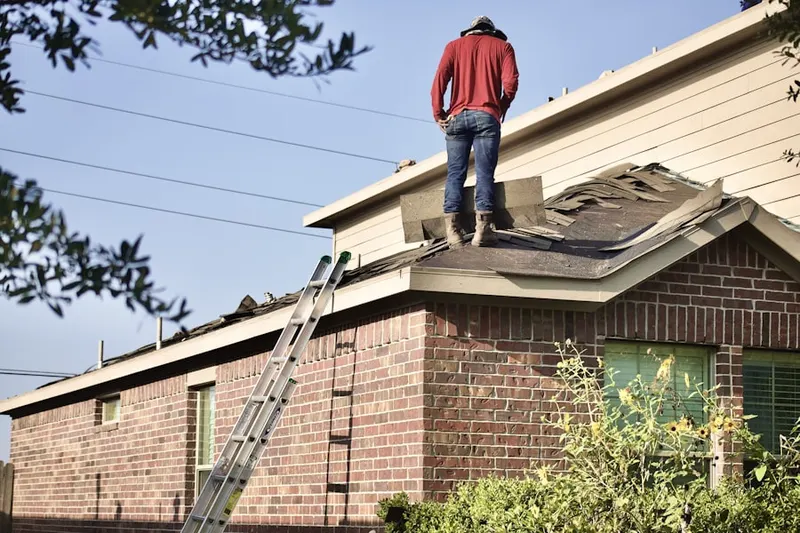 Professional roofer working on a residential roof in National Gardens